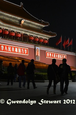 People Walk by the Tiananmen Portrait of Mao Zedong at Night,
Photographed by Gwendolyn Stewart c. 2013; All Rights Reserved